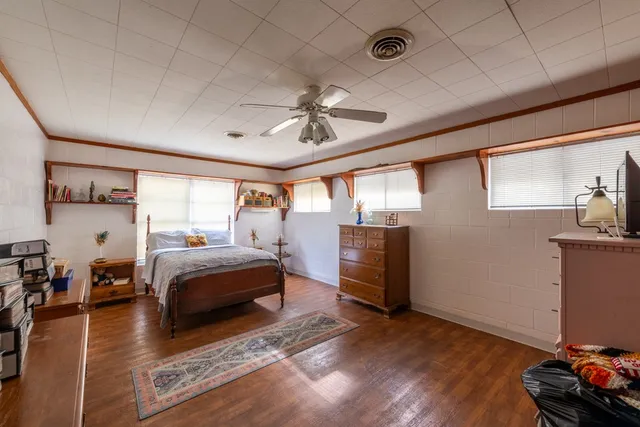a bath room with a shower curtain and a window