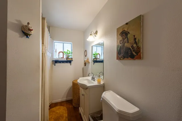 a kitchen with stainless steel appliances granite countertop a stove a washer and dryer