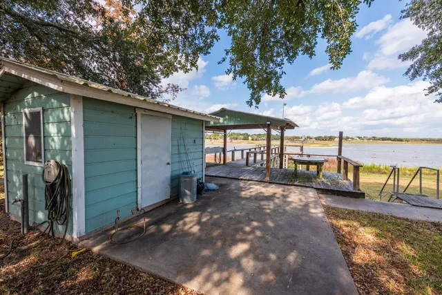 a view of a swimming pool with an outdoor space and seating area