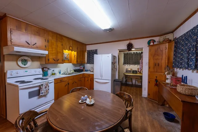 a living room with furniture pool table and a fireplace