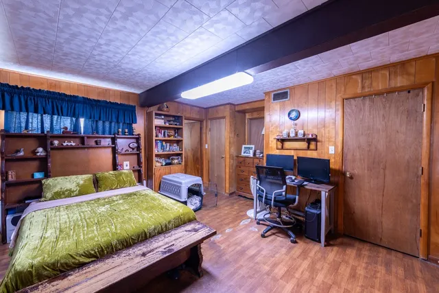 a spacious bathroom with a granite countertop sink and a mirror
