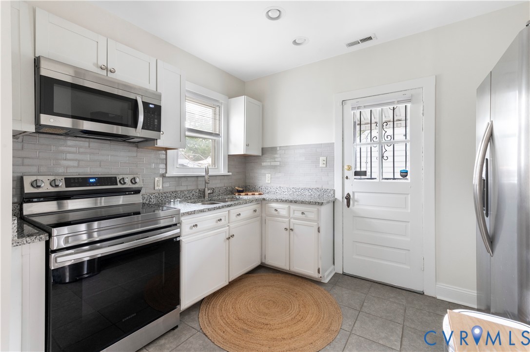 613 Rothesay Road Richmond, VA 23221 - Photo 11 of 36 Kitchen featuring stainless steel appliances, whit