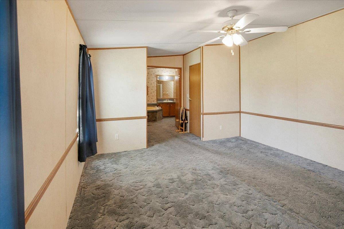 2014 Chad Place Angier, NC 27501 - Photo 18 of 47 a view of a big room with a chandelier fan and refrigerator