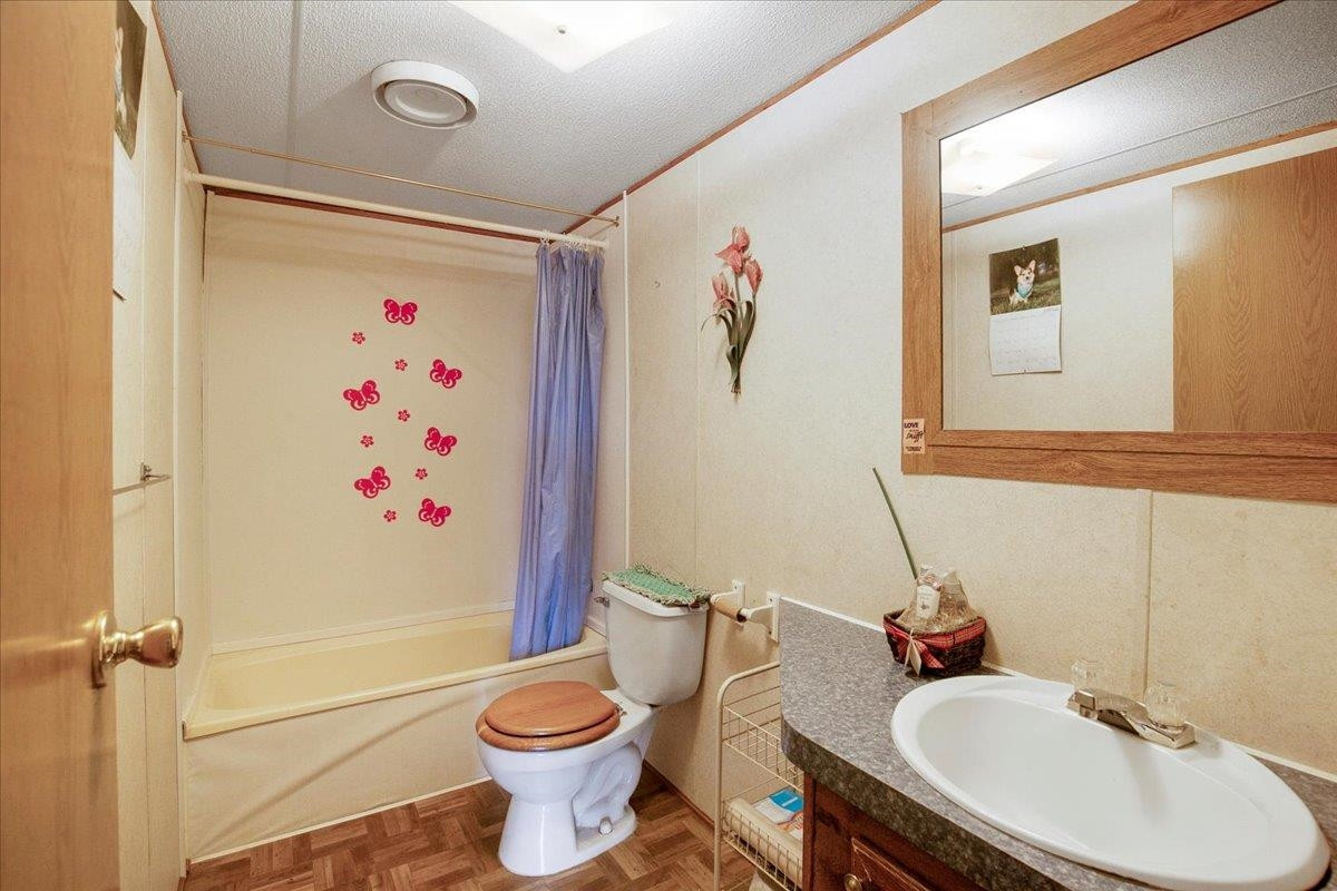 2014 Chad Place Angier, NC 27501 - Photo 32 of 47 a bathroom with a sink toilet and shower