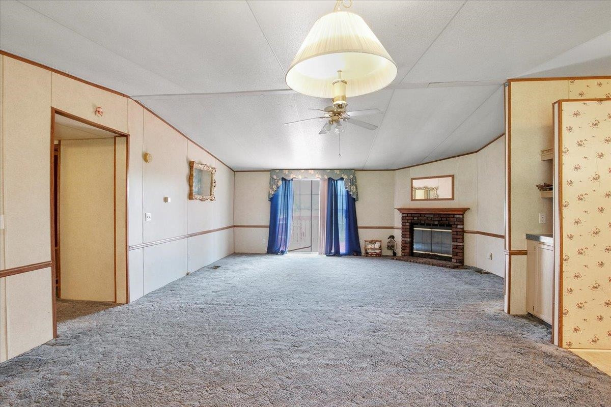 2014 Chad Place Angier, NC 27501 - Photo 5 of 47 a view of livingroom with kitchen island furniture and a chandelier
