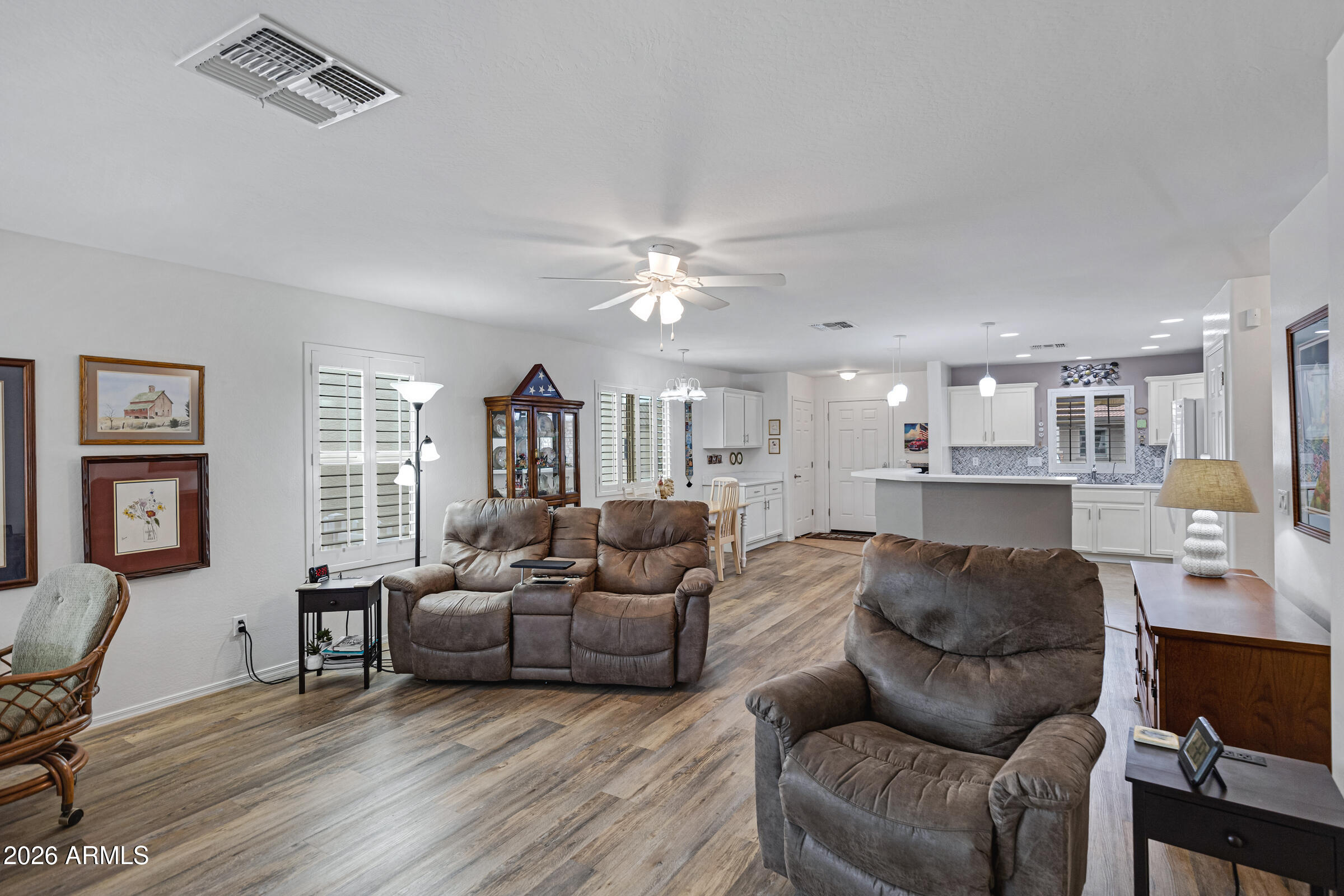 2101 South Meridian Road, Unit 199 Apache Junction, AZ 85120 - Photo 13 of 26 a living room with furniture and a large window