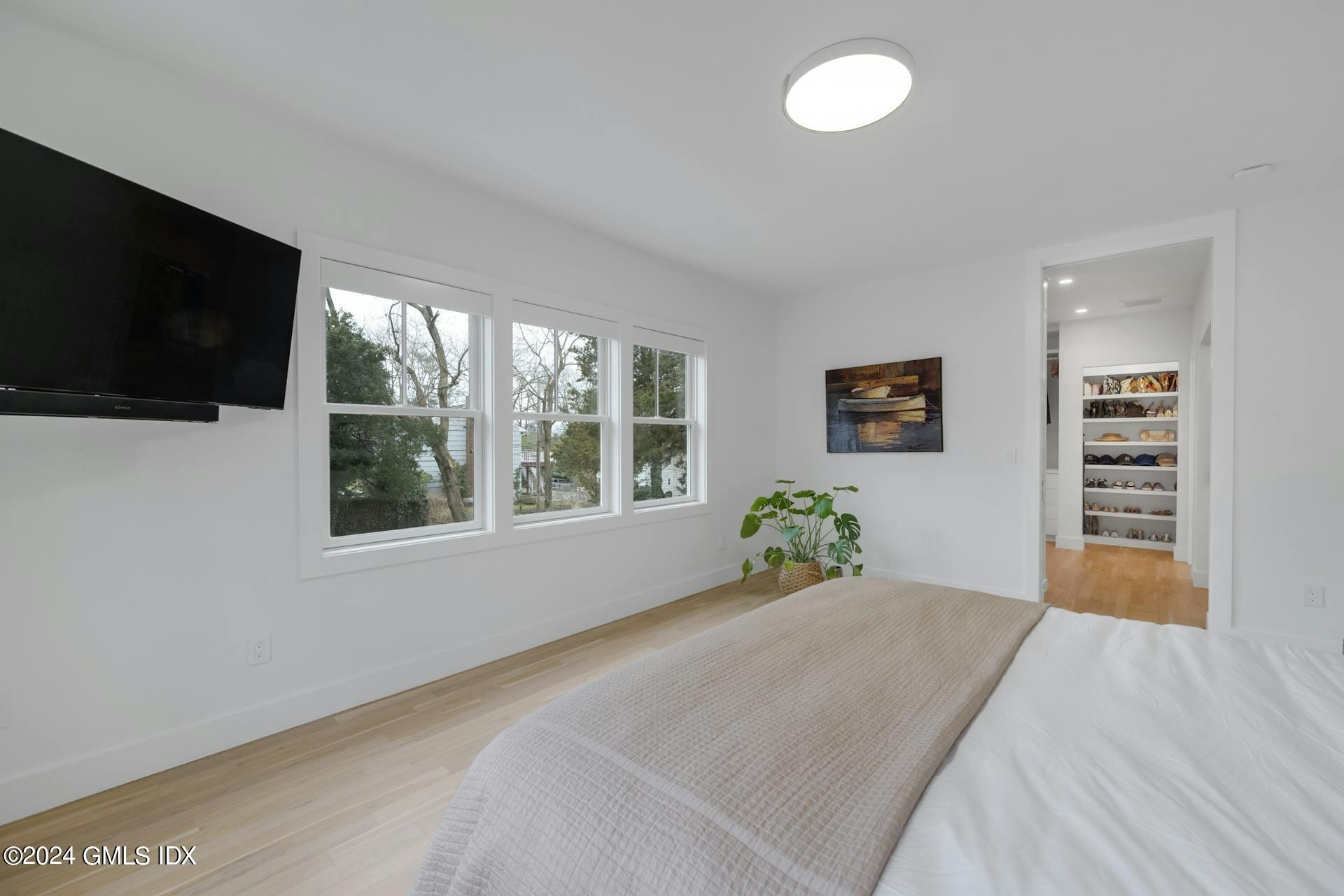 26 Chapel Lane Riverside, CT 06878 - Photo 17 of 35 a bed room with a bed and a television
