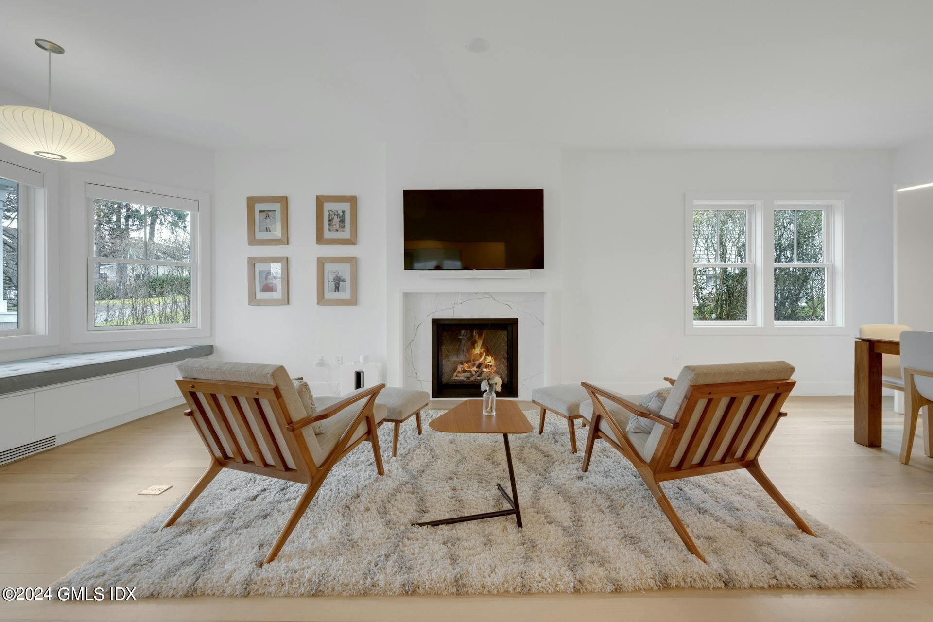 26 Chapel Lane Riverside, CT 06878 - Photo 3 of 35 a living room with furniture and a flat screen tv