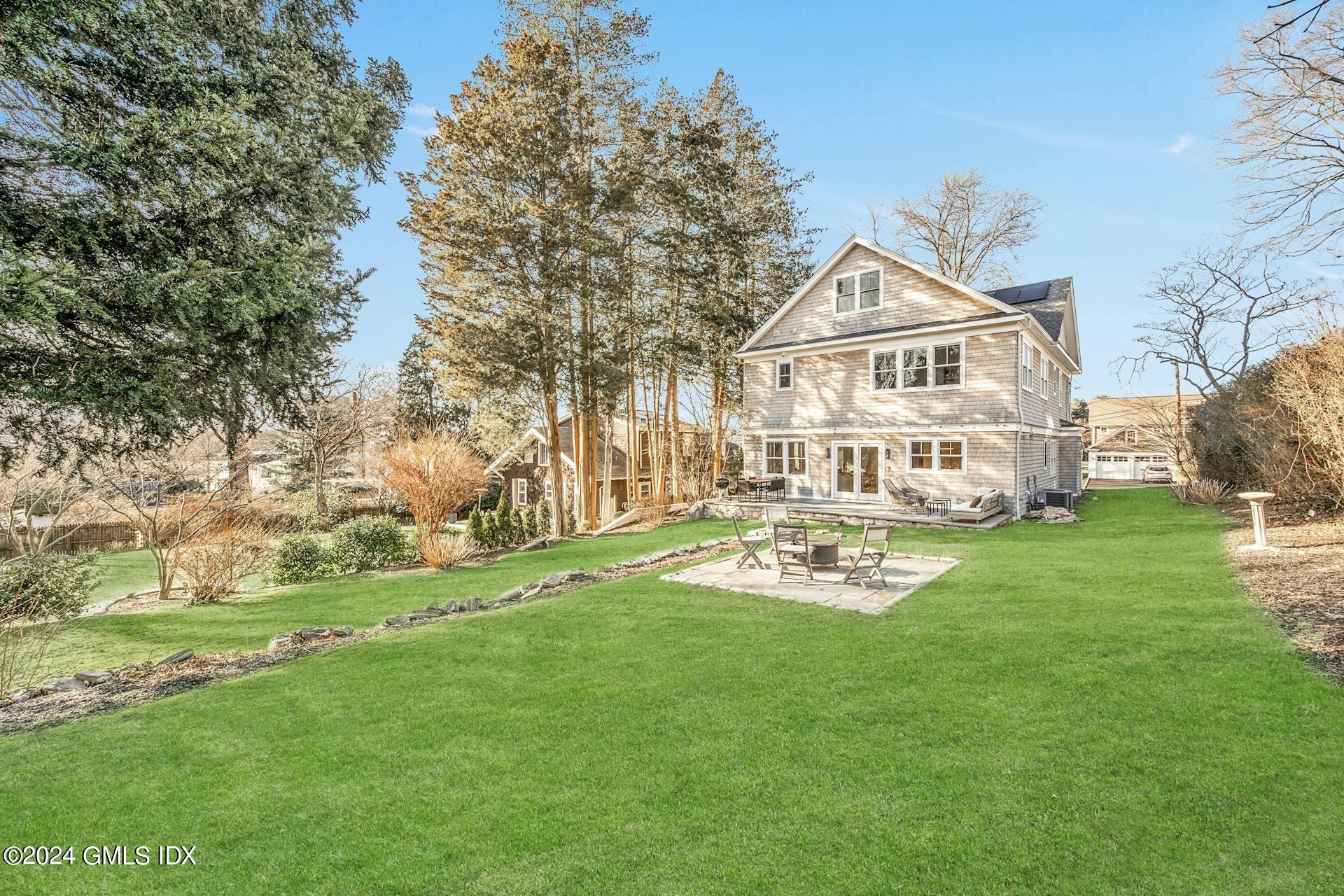 26 Chapel Lane Riverside, CT 06878 - Photo 35 of 35 a white house with a big yard and more large trees
