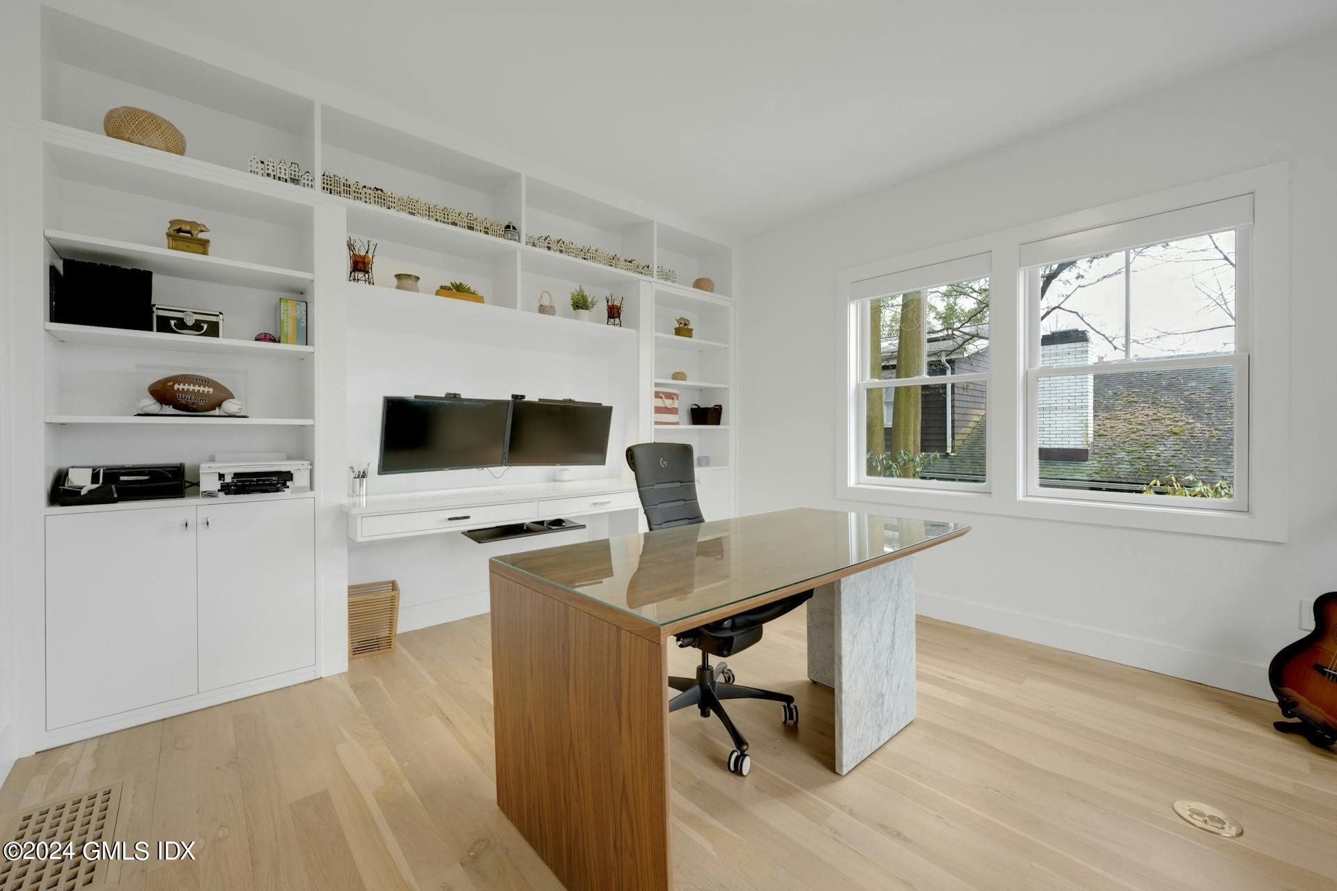 26 Chapel Lane Riverside, CT 06878 - Photo 7 of 35 a view of a workspace with furniture and a window