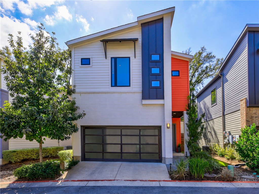 2807 Del Curto Road, Unit M Austin, TX 78704 - Photo 1 of 1 a front view of a house with a garage