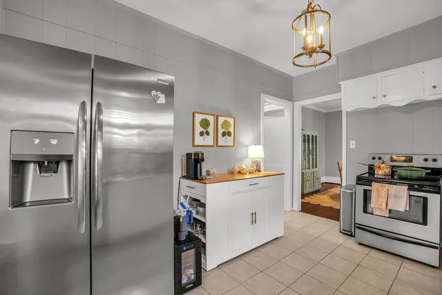a kitchen with cabinets and stainless steel appliances