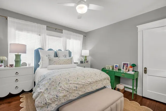a bedroom with a bed and a dresser