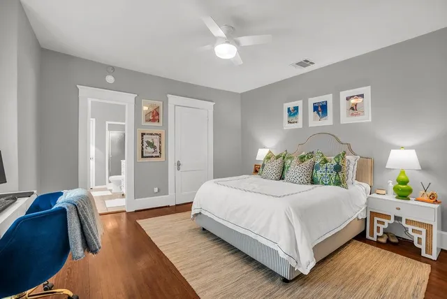 a bedroom with a bed and a couch