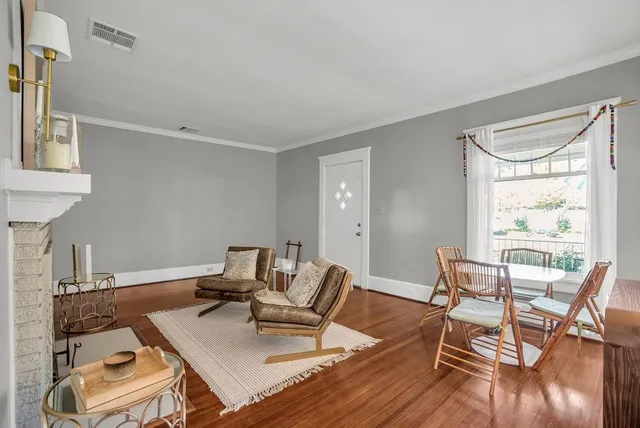 a workspace with furniture and wooden floor
