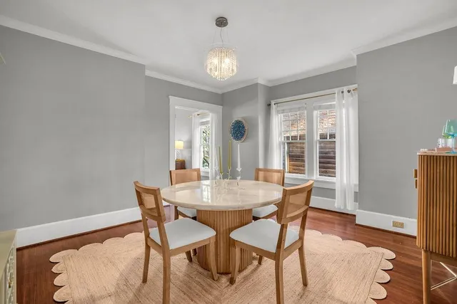 a dining room with furniture and window