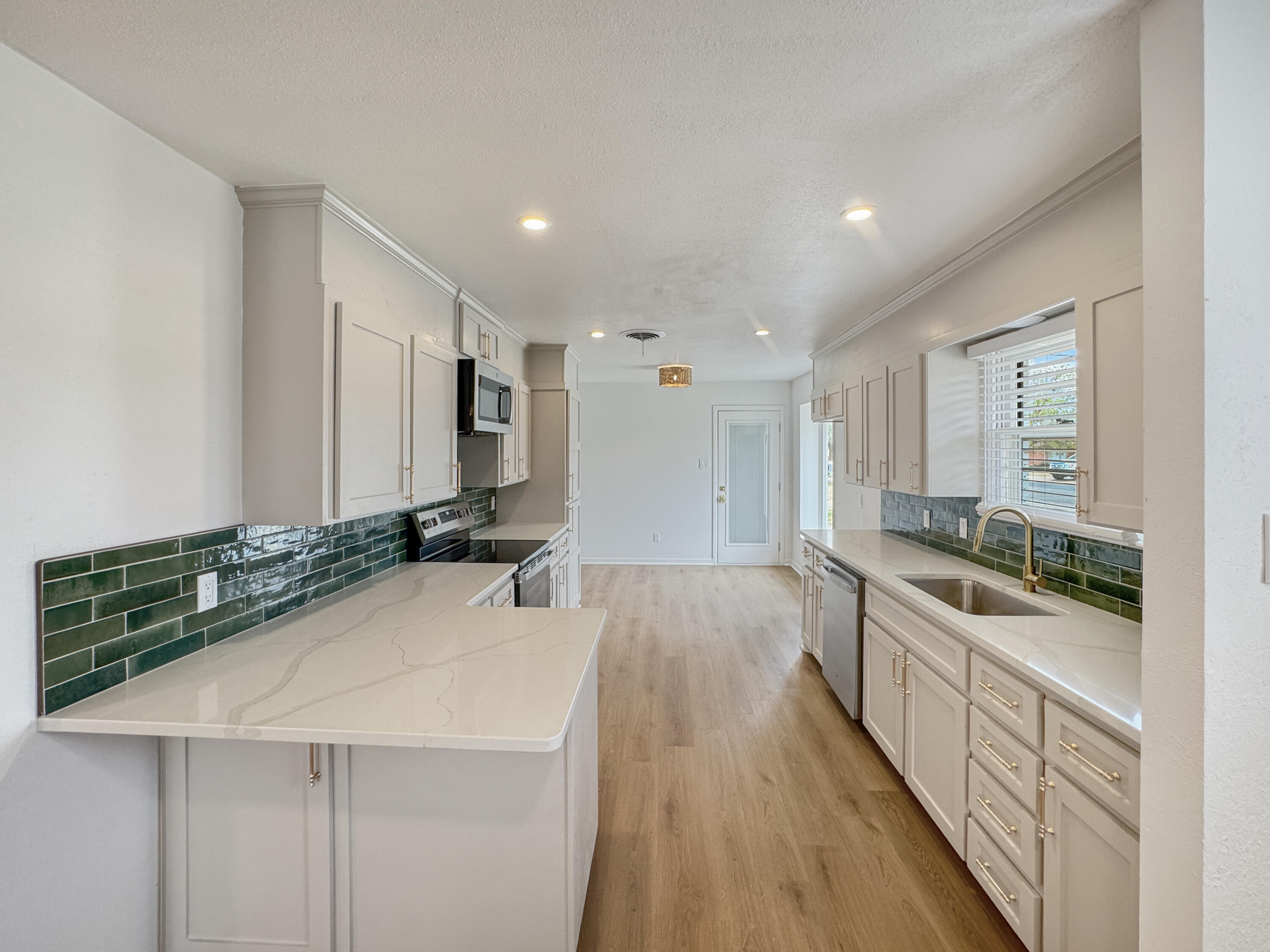 5502 8th Street Lubbock, TX 79416 - Photo 19 of 41 a bathroom with a sink and a mirror