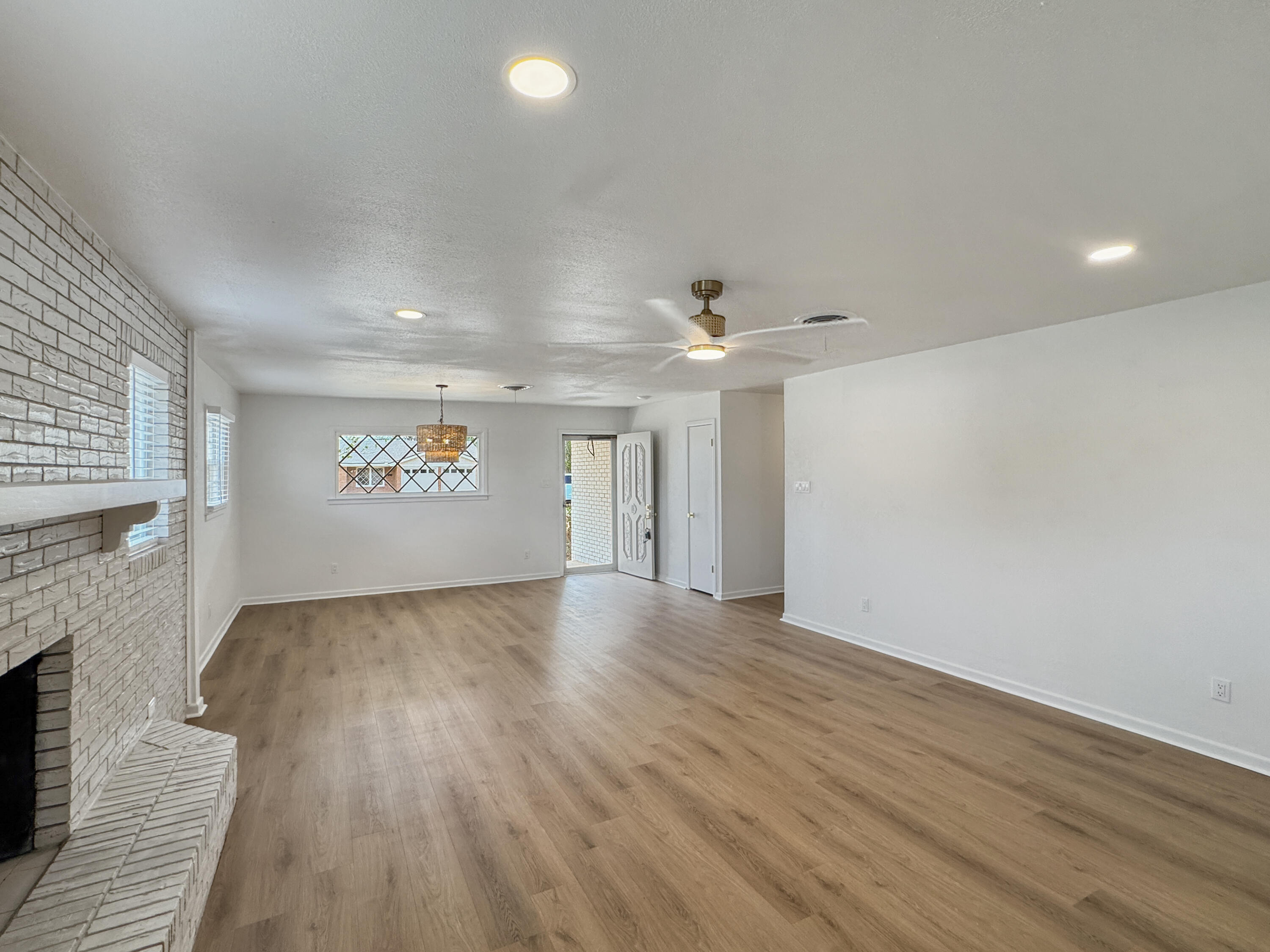 5502 8th Street Lubbock, TX 79416 - Photo 25 of 41 wooden floor in an empty room with a window
