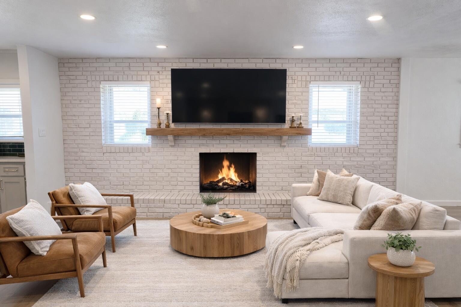 5502 8th Street Lubbock, TX 79416 - Photo 3 of 41 a living room with furniture and a flat screen tv