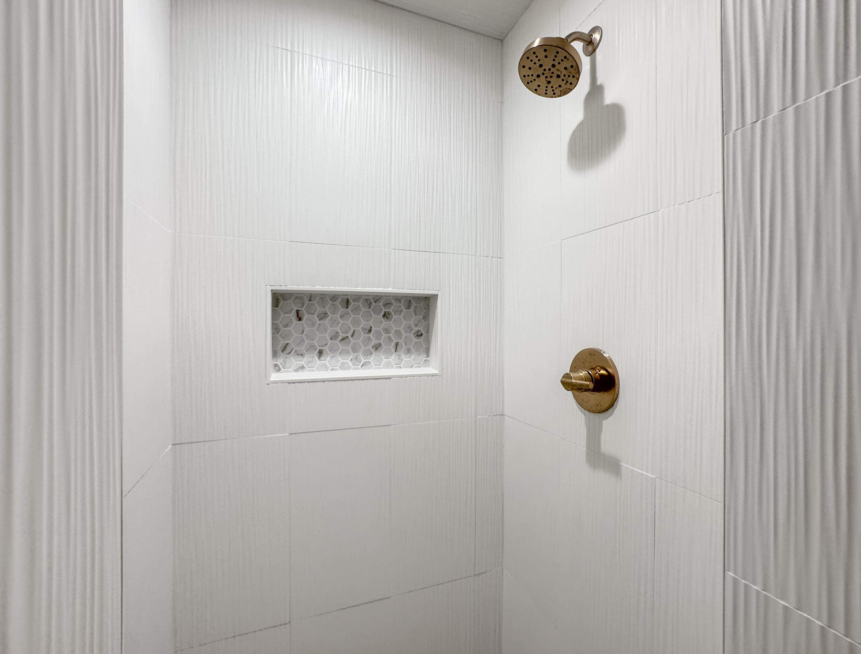 5502 8th Street Lubbock, TX 79416 - Photo 36 of 41 a bathroom with a shower and mirror