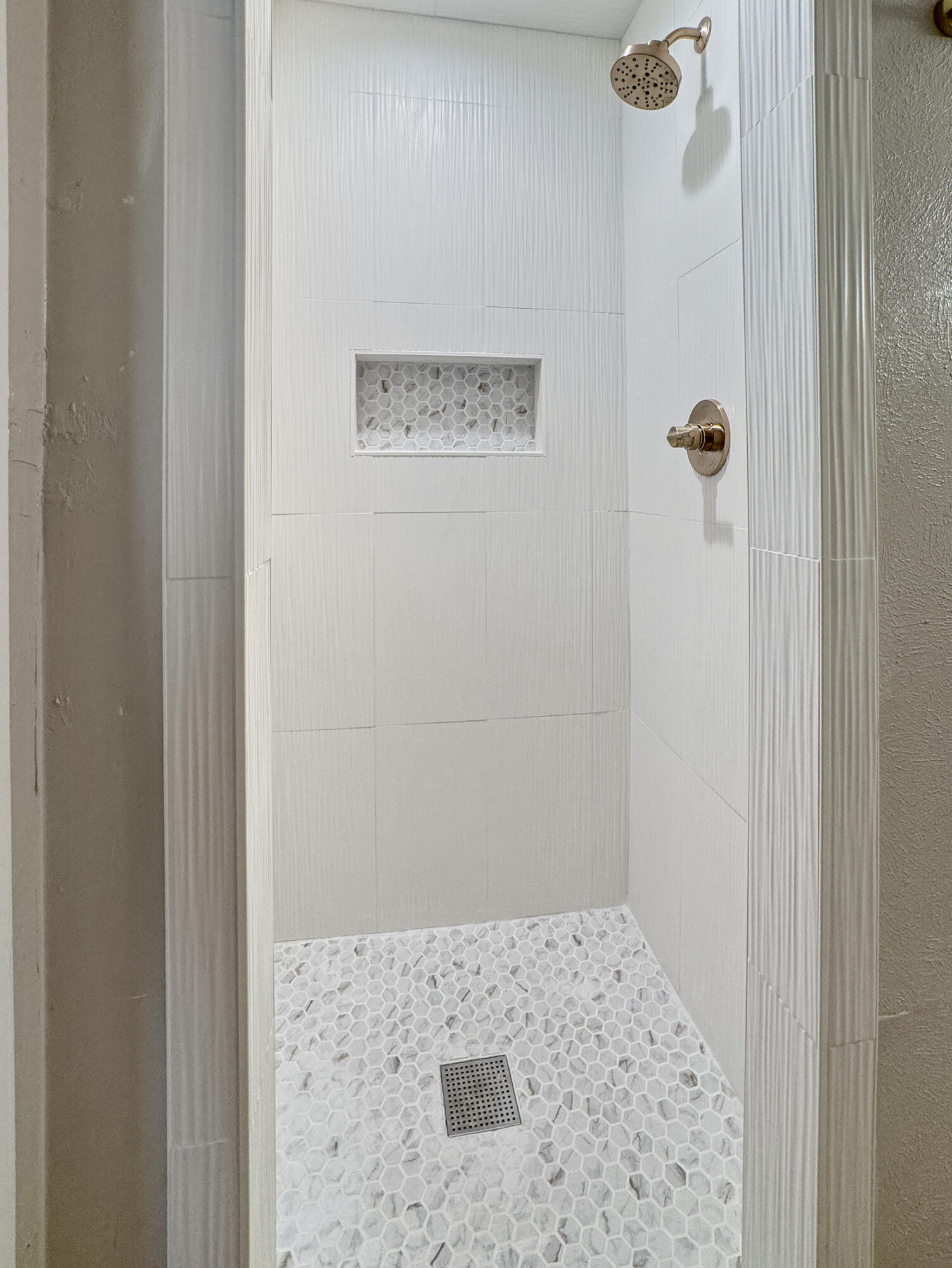 5502 8th Street Lubbock, TX 79416 - Photo 39 of 41 a bathroom with a shower
