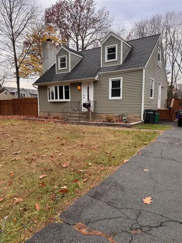 a front view of a house with yard