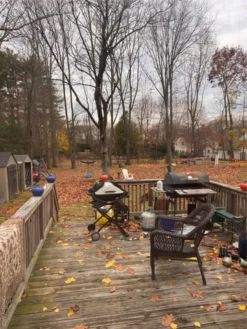 a view of a terrace with furniture and trees