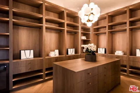 a kitchen with a cabinets and chandelier