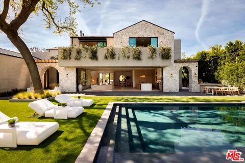a front view of house with swimming pool