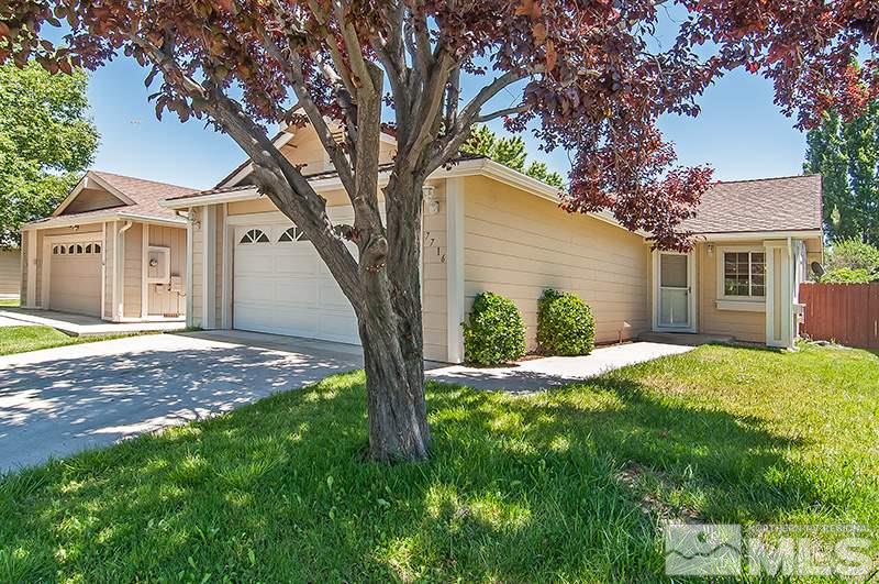 7716 Pickering Circle Reno, NV 89511 - Photo 1 of 15 a view of a house with a tree in a yard