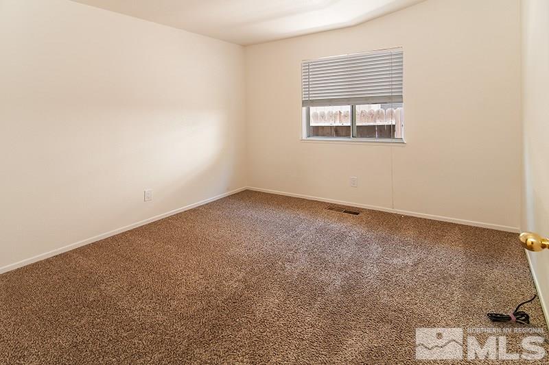 7716 Pickering Circle Reno, NV 89511 - Photo 11 of 15 an empty room with a window