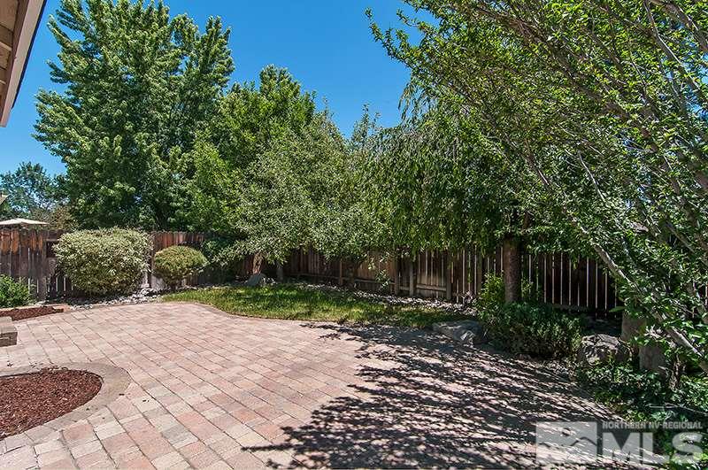 7716 Pickering Circle Reno, NV 89511 - Photo 13 of 15 a view of backyard with plants and trees