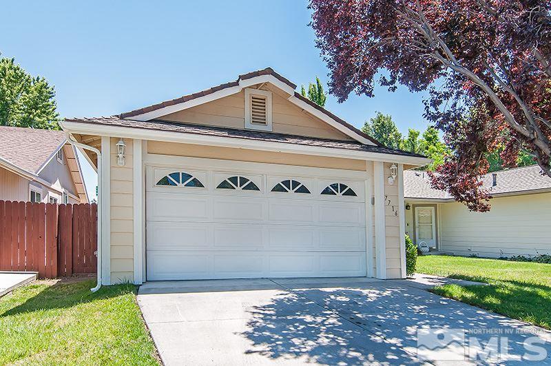 7716 Pickering Circle Reno, NV 89511 - Photo 15 of 15 a front view of a house with a yard and garage