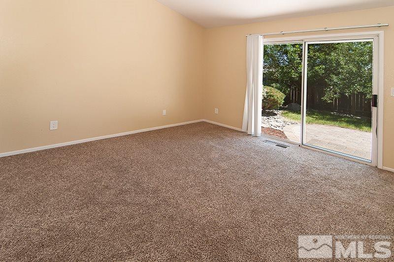 7716 Pickering Circle Reno, NV 89511 - Photo 8 of 15 a view of an empty room with glass windows