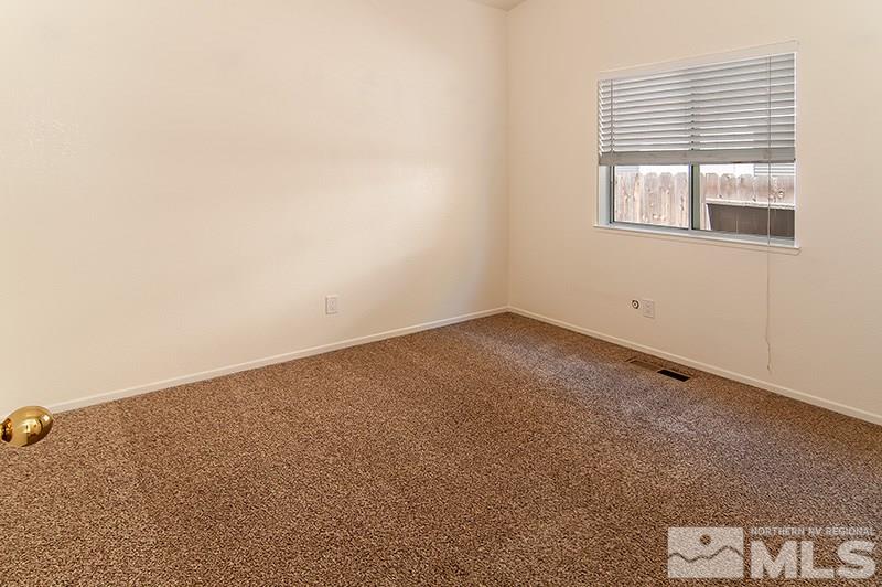 7716 Pickering Circle Reno, NV 89511 - Photo 10 of 15 an empty room with a window
