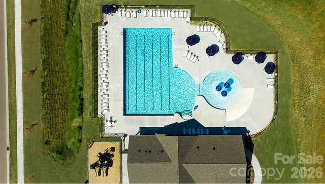 a living room with a baby crib and a wooden floor