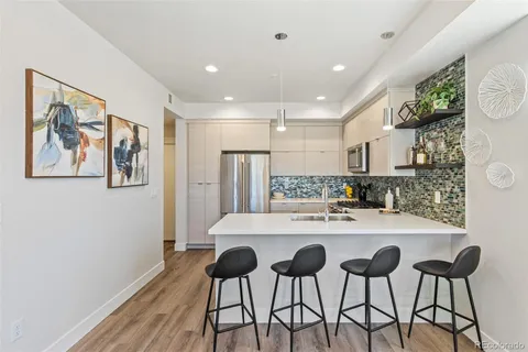 a kitchen with a table and chairs