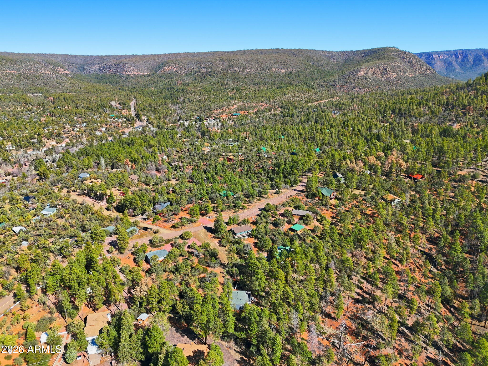 8247 Ralls Drive Pine, AZ 85544 - Photo 36 of 50 a view of a lush green forest with a mountain