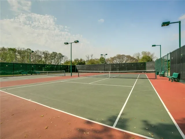 a view of tennis court with basket ball court