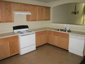 a utility room with sink dryer and washer