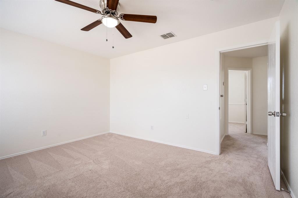 1626 White Oak Road Anna, TX 75409 - Photo 18 of 30 a view of a chandelier fan in a room