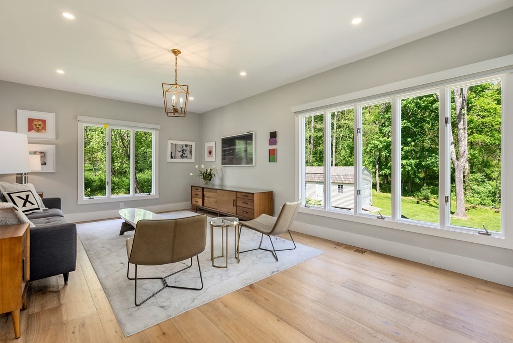 338 South Great Road Lincoln, MA 01773 - Photo 13 of 29 a living room with furniture and a large window