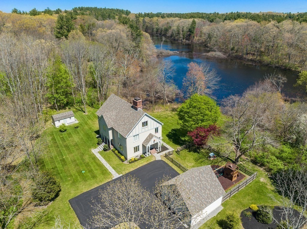 338 South Great Road Lincoln, MA 01773 - Photo 2 of 29 an aerial view of a house with a garden and lake view