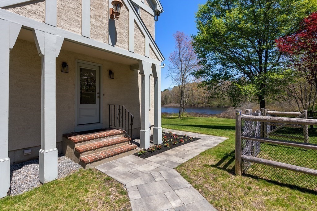 338 South Great Road Lincoln, MA 01773 - Photo 26 of 29 a view of backyard with wooden fence and a large tree