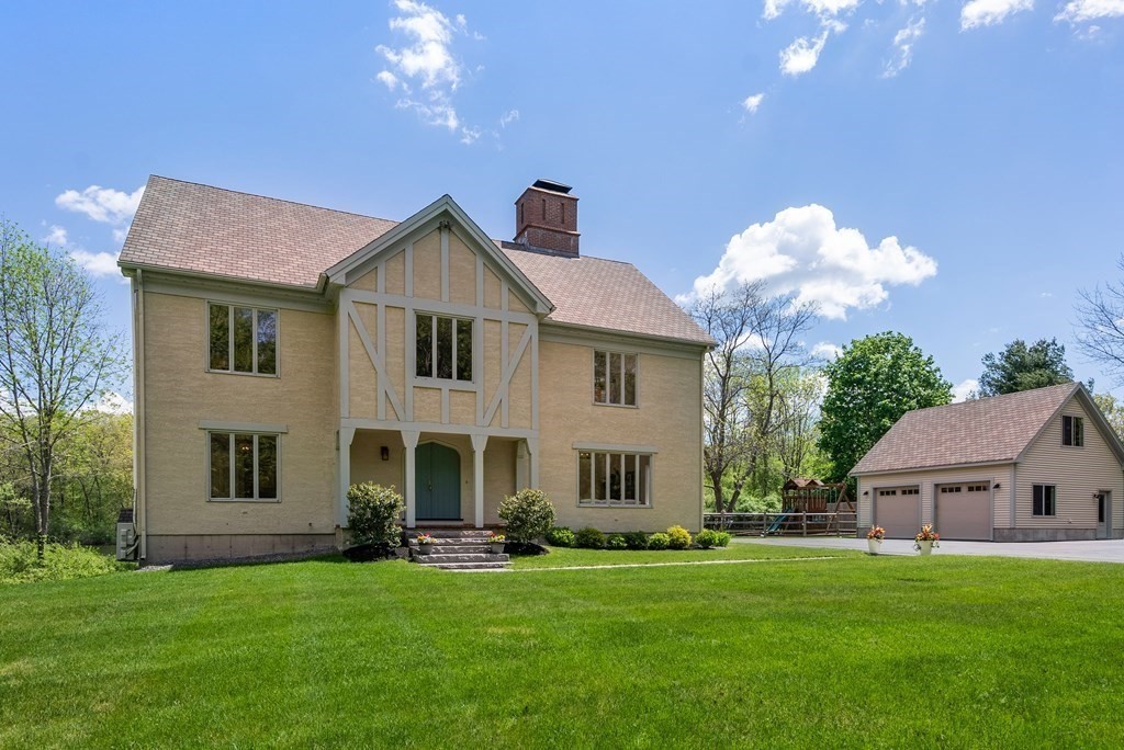 338 South Great Road Lincoln, MA 01773 - Photo 3 of 29 a front view of a house with a yard