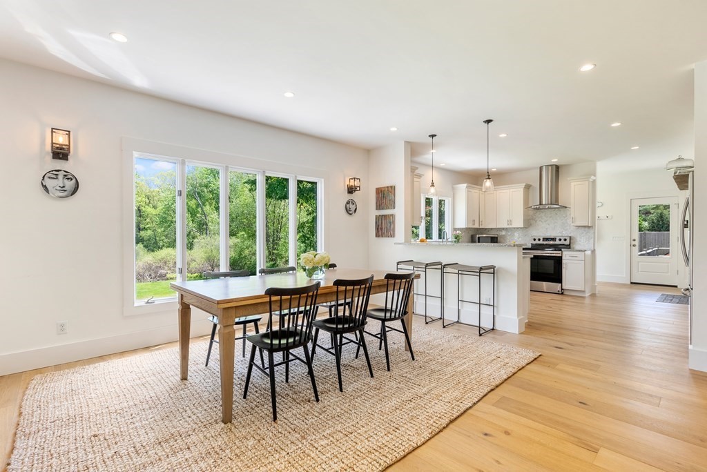 338 South Great Road Lincoln, MA 01773 - Photo 9 of 29 a dining room with furniture and wooden floor