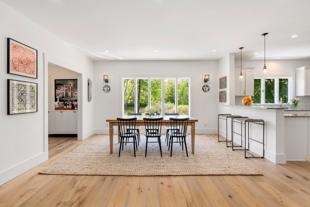 338 South Great Road Lincoln, MA 01773 - Photo 10 of 29 a dining room with furniture and a floor to ceiling window