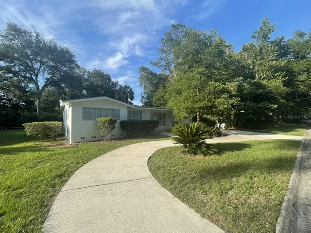 a garden view with a fountain
