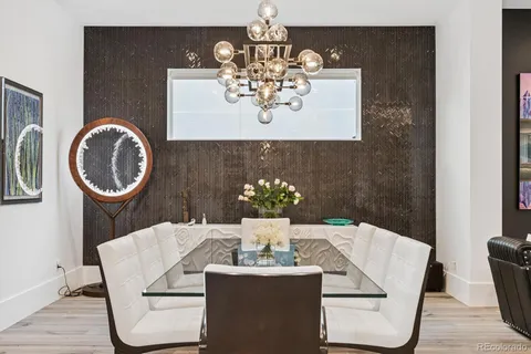 a dining room with table and chairs