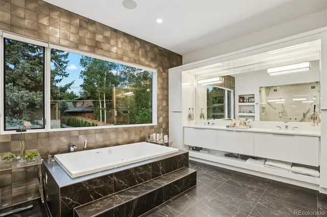 a room with pool table and windows